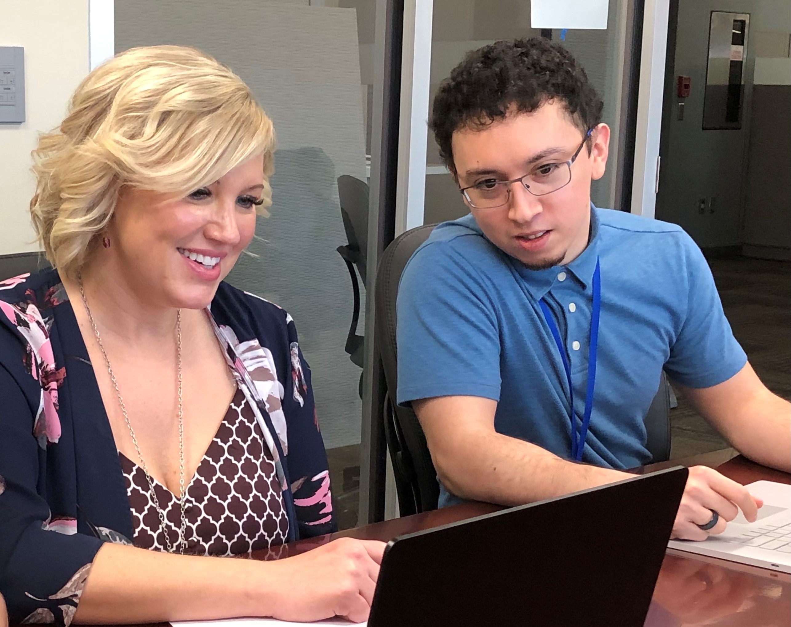 biBerk IT person helping other employee