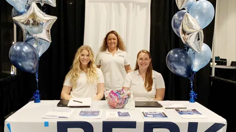 biBerk employees at booth at a convention
